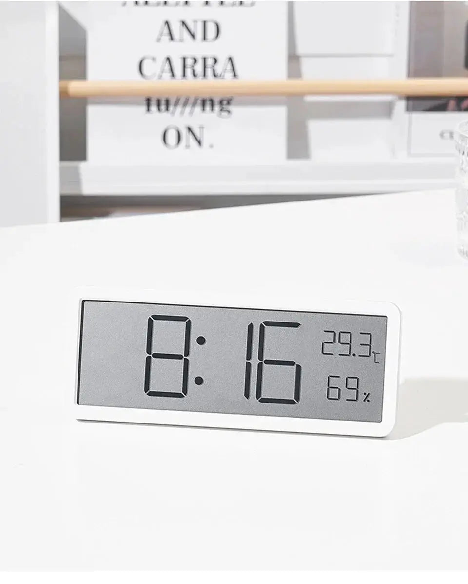 Simples Market white LCD digital desk clock displaying time 8:16, 29.3°C and 69% humidity