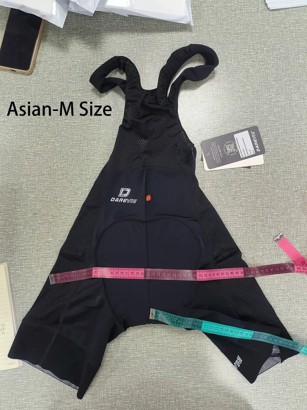 DAREVIE men's black cycling bib shorts with mesh panels, breathable fabric, and 3D gel pad.