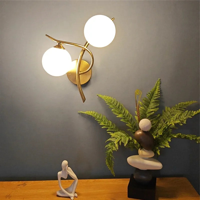 Simples Market Nordic modern iron wall lamp with two glass globes, brass finish, LED G9