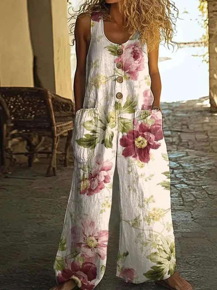 Jumpsuit by Simples Market, white floral print, sleeveless with button front, wide-leg with pockets