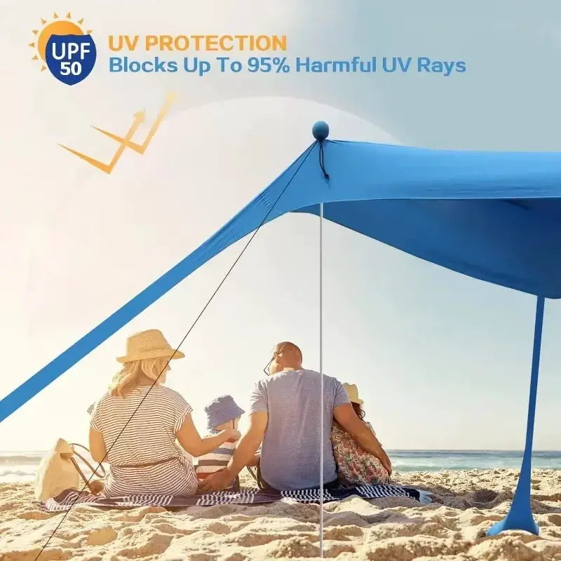 Camping tent windproof pop-up beach canopy in blue by Simples Market with UV protection on a sunny beach.