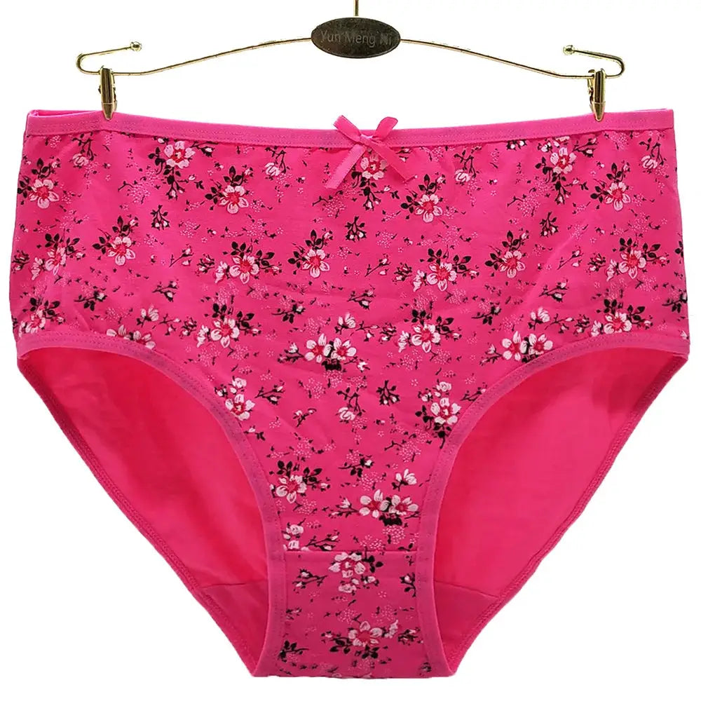 Women's pink cotton panties with floral pattern and small bow, mid-rise brief.