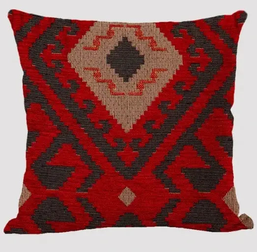 Linen cushion cover from Simples Market with bohemian geometric pattern in red, black and beige.