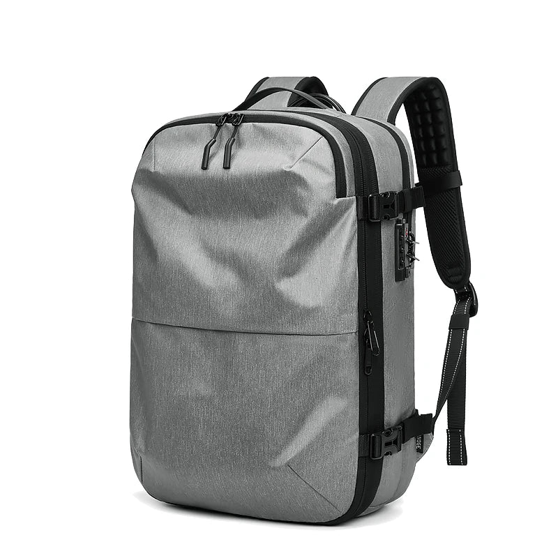 Men's travel backpack by Simples Market, grey, 17-inch laptop compartment, expandable design, padded shoulder straps.