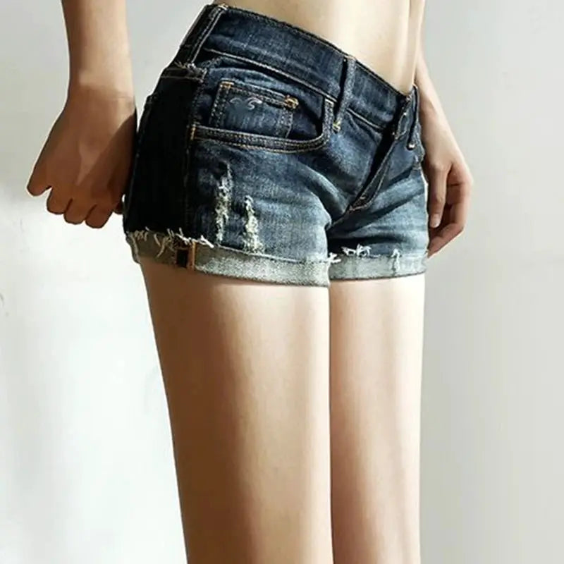 Women's denim shorts by Simples Market, low waist, distressed deep blue with rolled cuffs