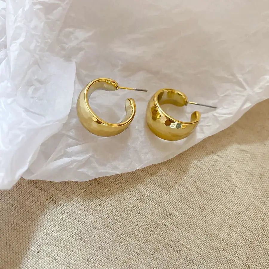 Gold-toned irregular oval acrylic stud earrings, unisex pair with open hoop design