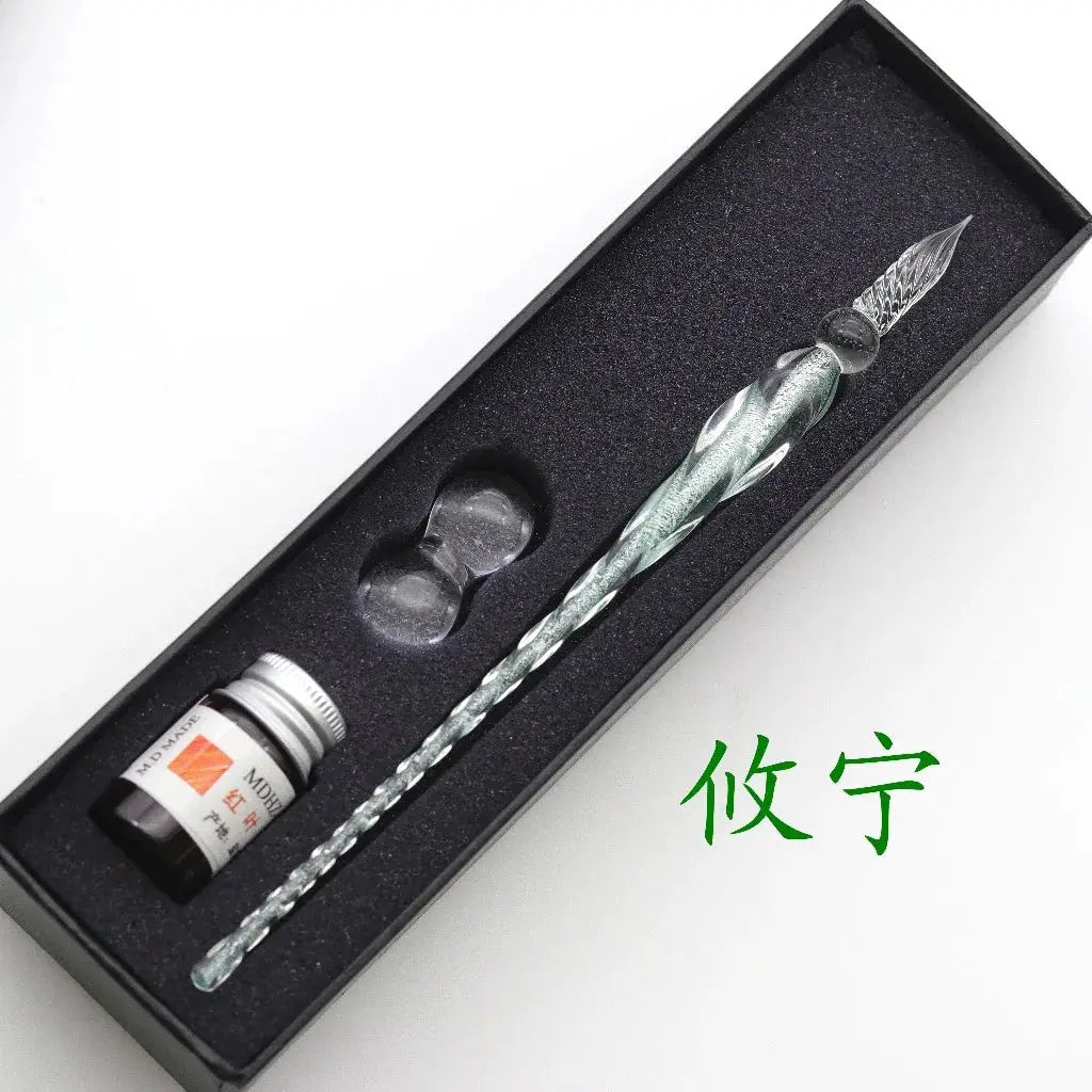 Crystal glass dip pen gift set with iridescent teal swirl and ink bottle in a black foam-lined box