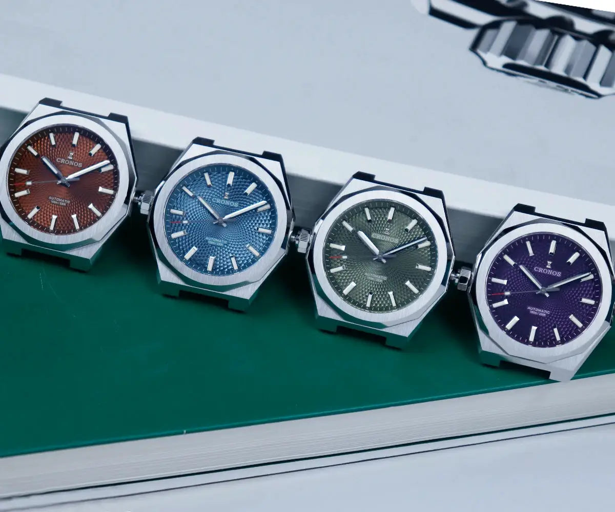Cronos watches; four rhombus-case models with textured dials in red, blue, green and purple.