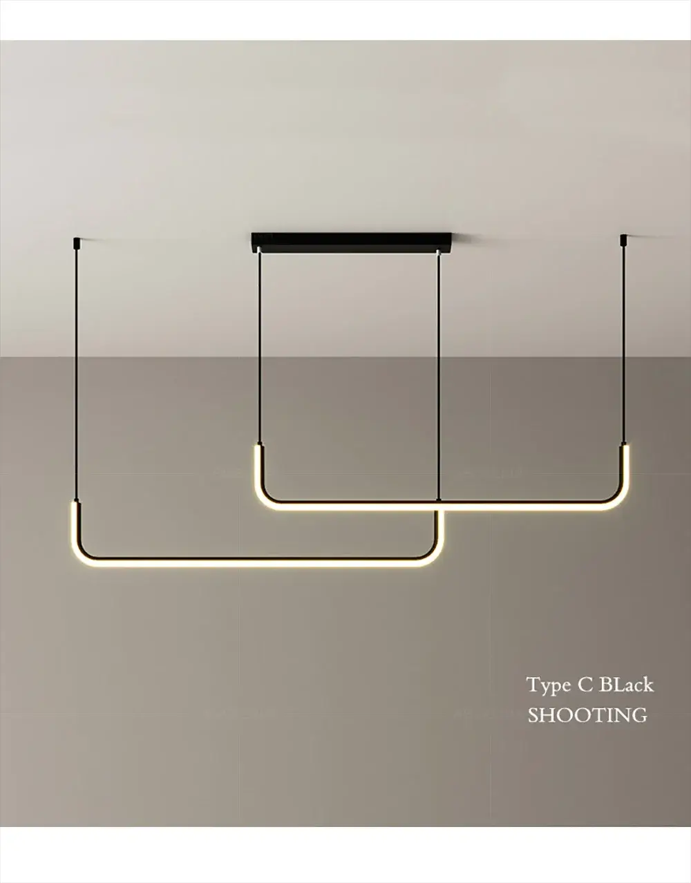 Modern LED strip chandelier in gold with two curved light arms and black suspension cords