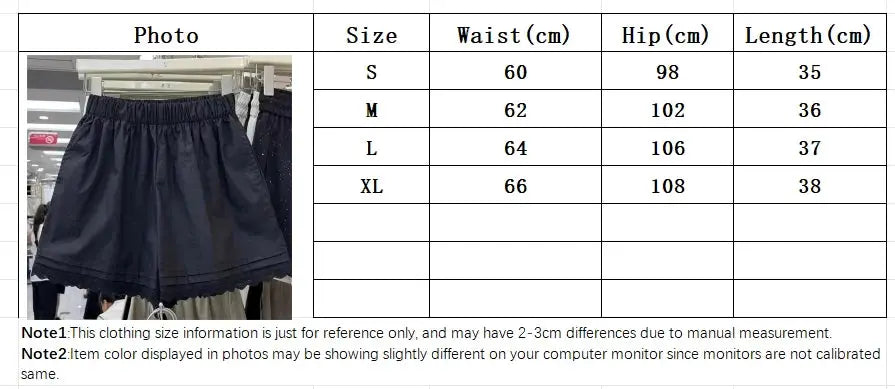 Women's black casual shorts with elastic waist and loose wide-leg fit