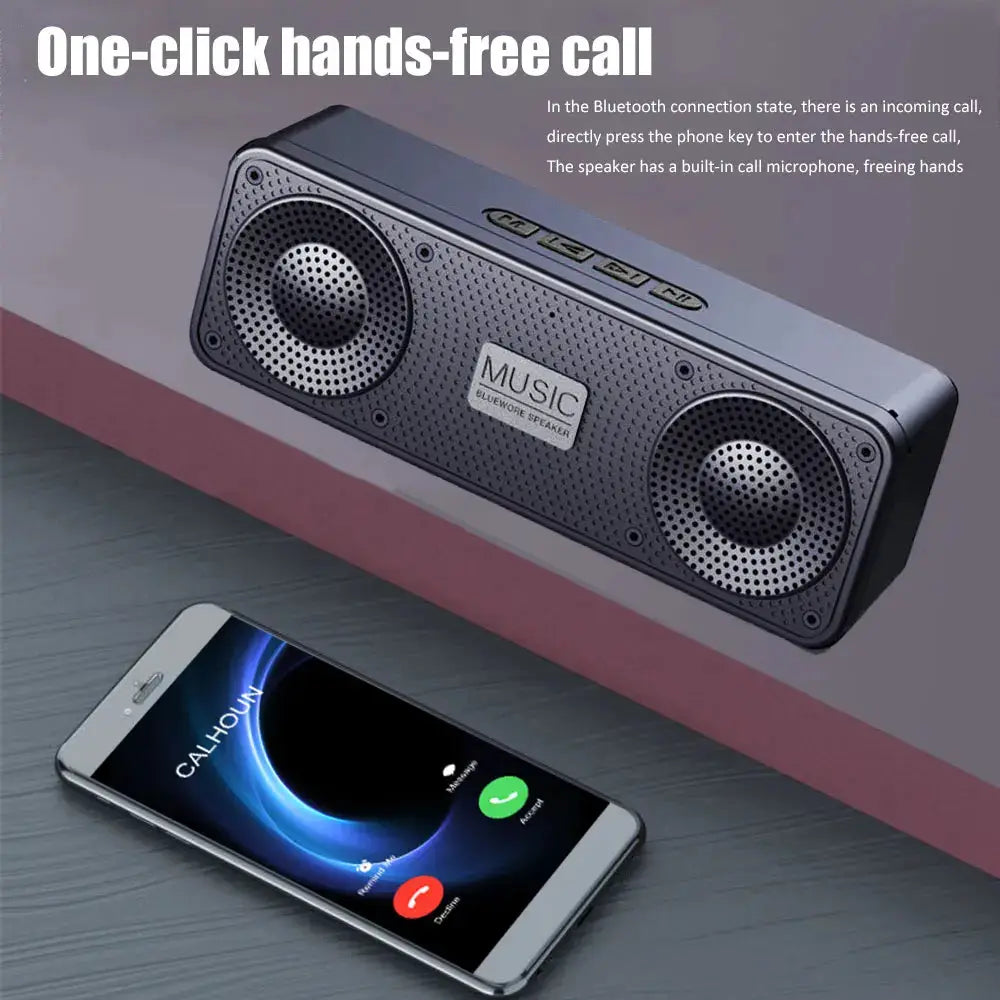 S18 wireless Bluetooth speaker with dual round drivers in black, portable beside a smartphone