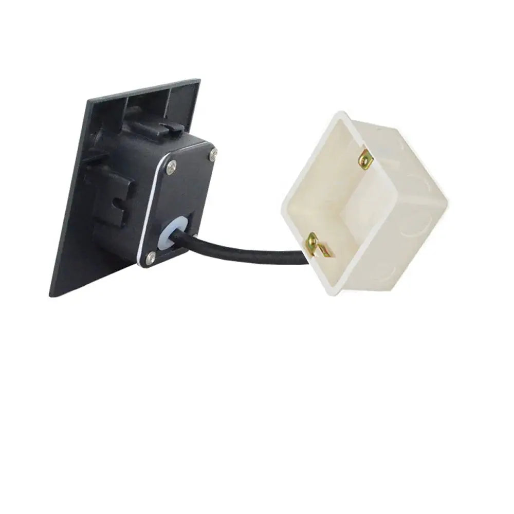 Outdoor recessed wall lamp with black mounting plate and white square housing.