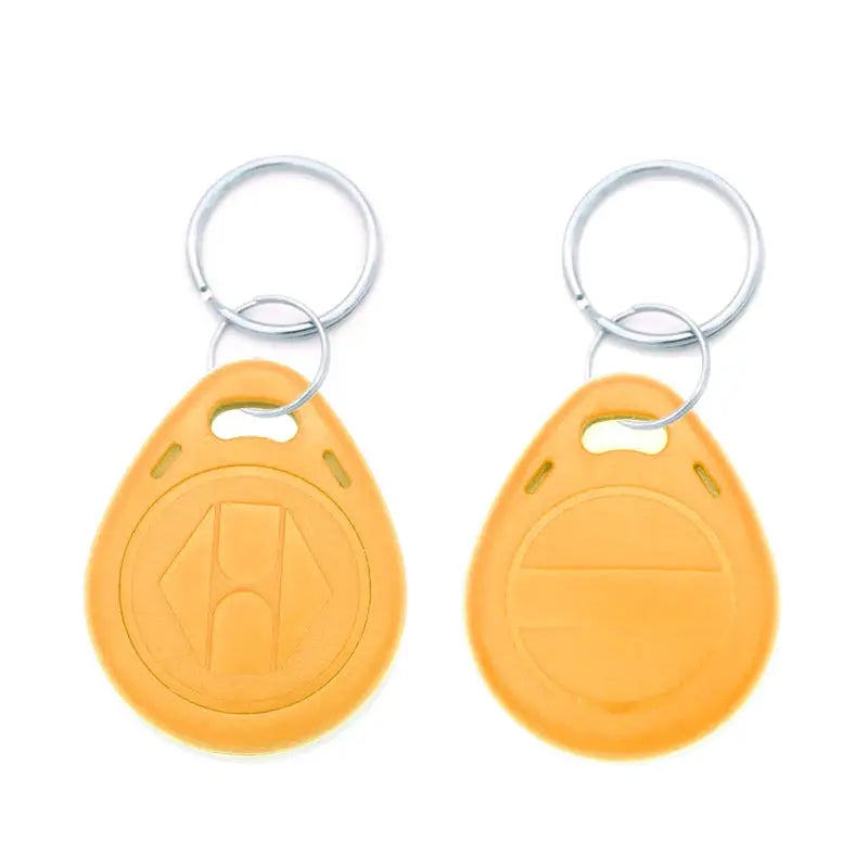 Two orange EM4305 125kHz key fobs on metal key rings; proximity RFID tokens