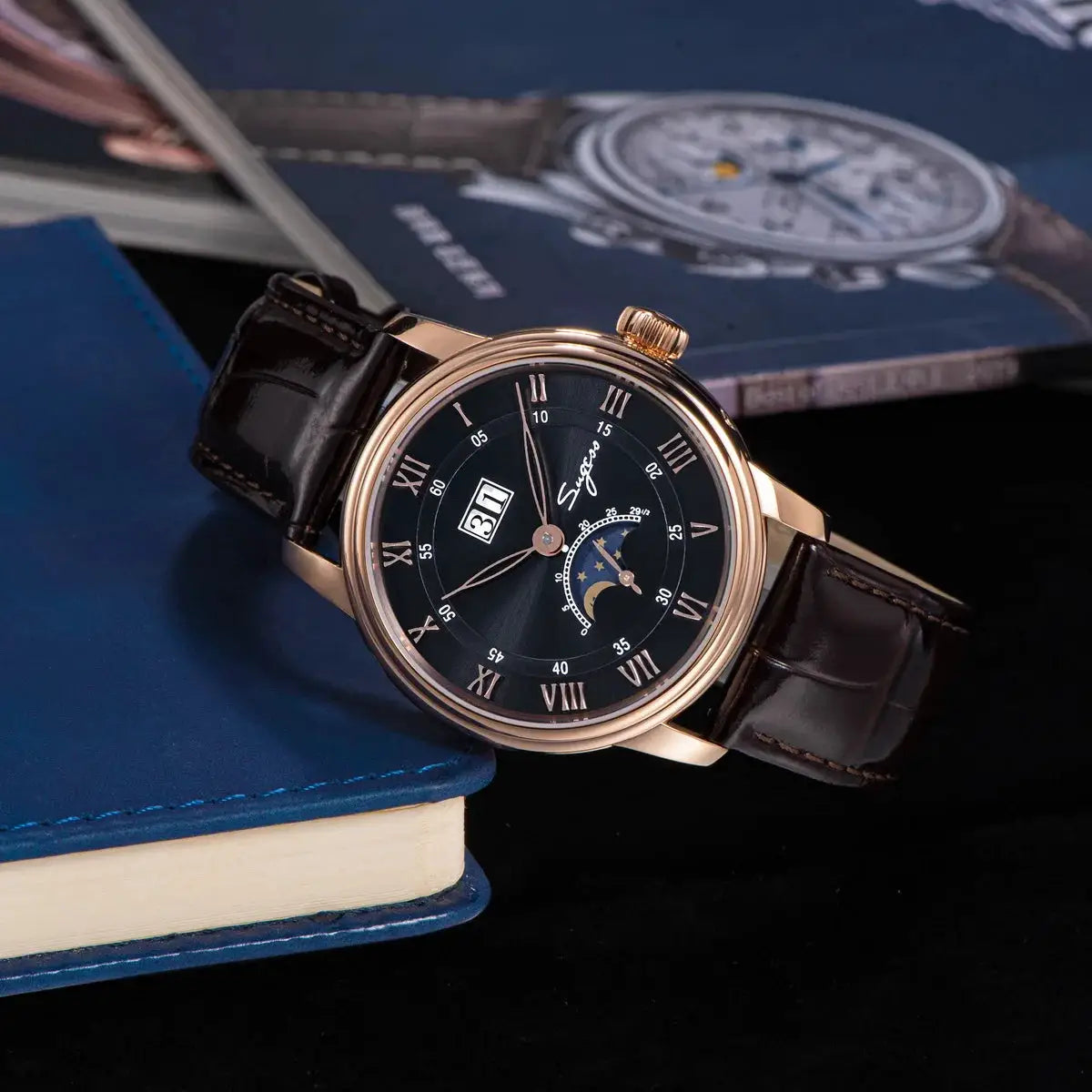 Sugess Moonphase men's watch with rose-gold case, black dial, Roman numerals, moonphase subdial, brown leather strap.