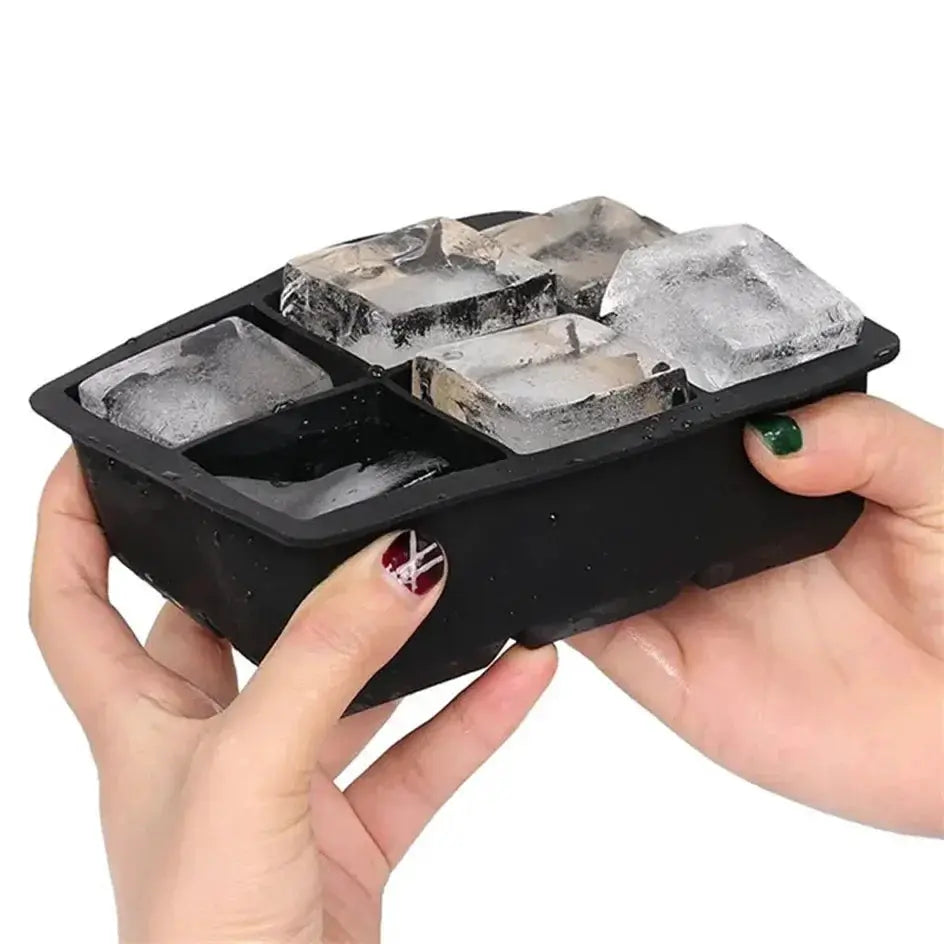 Black silicone ice cube tray with 4-grid layout, held by hands