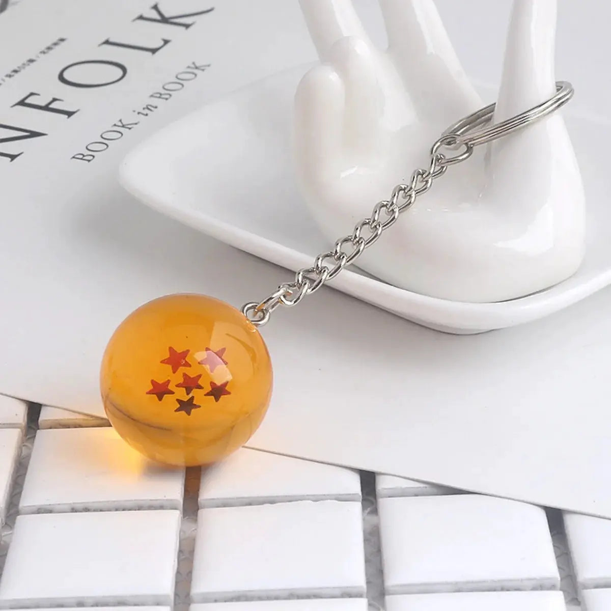 Dragon Ball keychain bead in orange with red stars, on a silver metal chain and ring