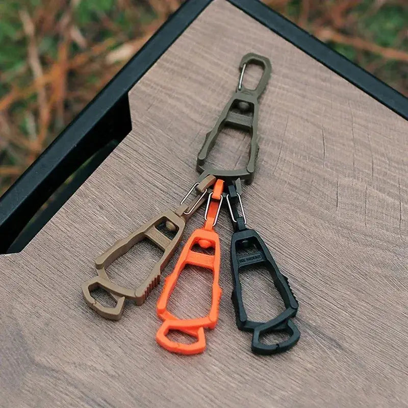 Outdoor protective glove clip hanger set with five color clips in olive, tan, orange, black and blue