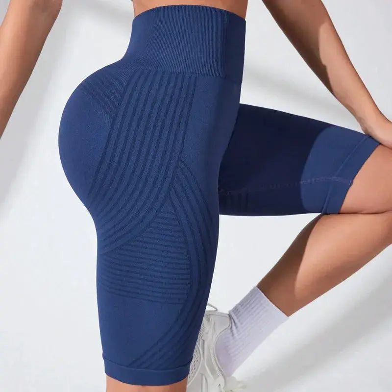 Women's high-waisted seamless yoga shorts in navy blue with a textured geometric pattern