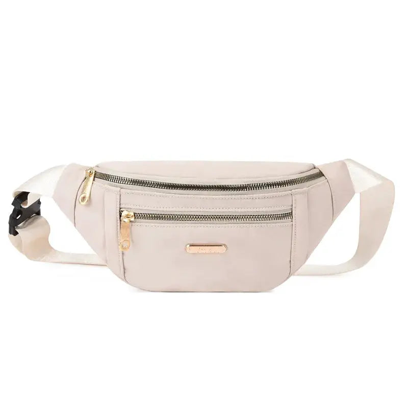 Beige fanny pack with two zip pockets and adjustable strap, lightweight belt bag