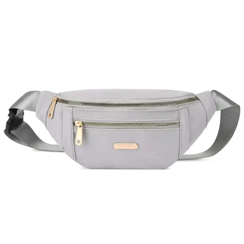 Simples Market grey fanny pack with gold zippers; lightweight waist bag for running, hiking and travel.