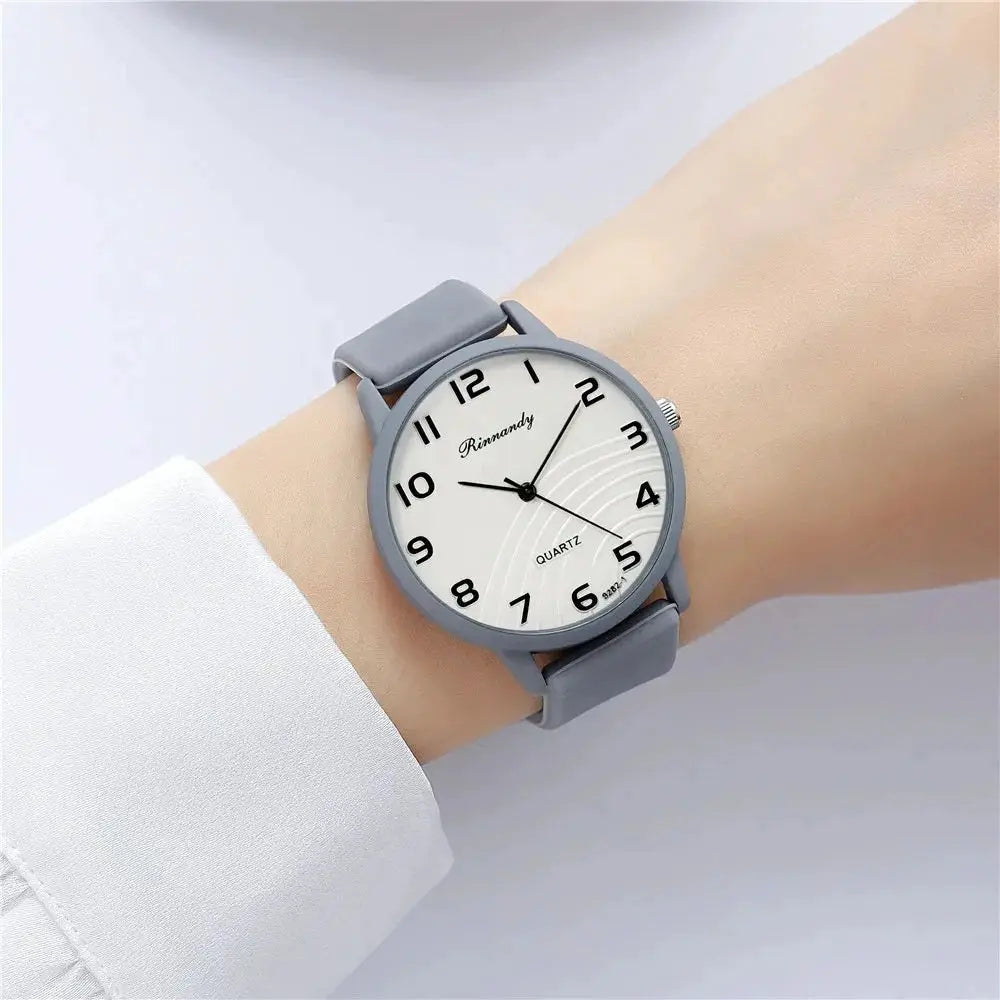 Women’s quartz watch with gray silicone band and white dial with Arabic numerals