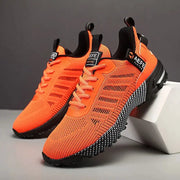 Simples Market men's orange breathable running shoes with a lightweight knit upper and black speckled outsole.