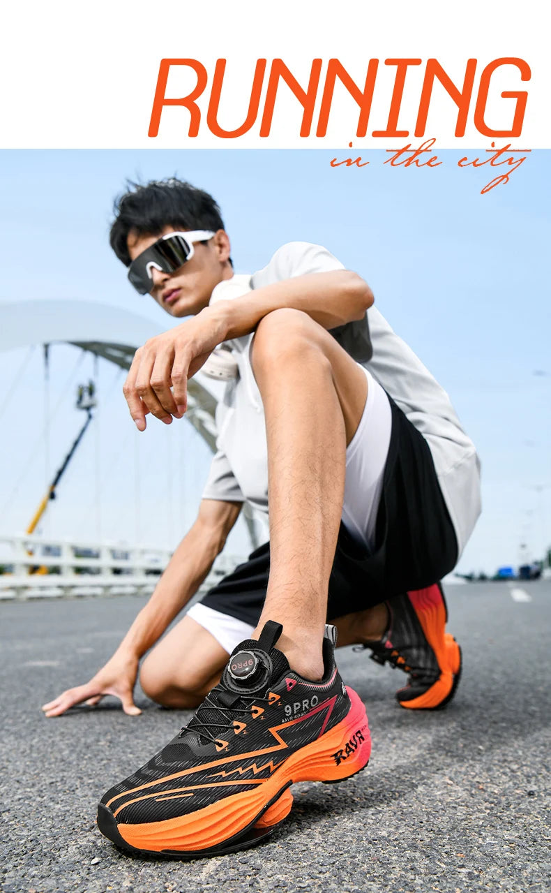 Men's running shoes, black upper with bright orange sole and accents, cushioned athletic design