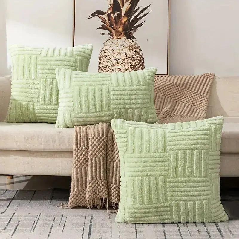 Boho faux fur plush throw pillow covers; five mint-green and beige textured cushions on sofa