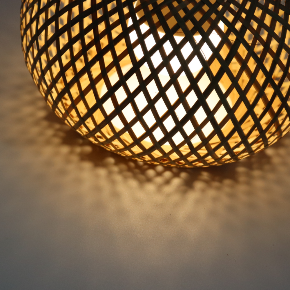Bamboo pendant lamp in natural rattan with hand-knitted lattice, warm ambient light