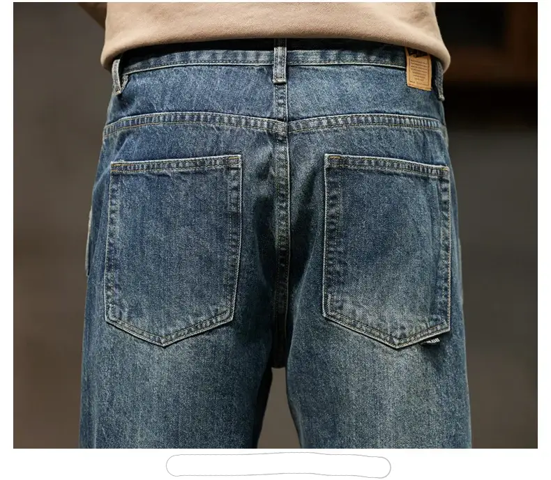 Men's Simples Market denim jeans, blue indigo, back view with two back pockets and leather patch.