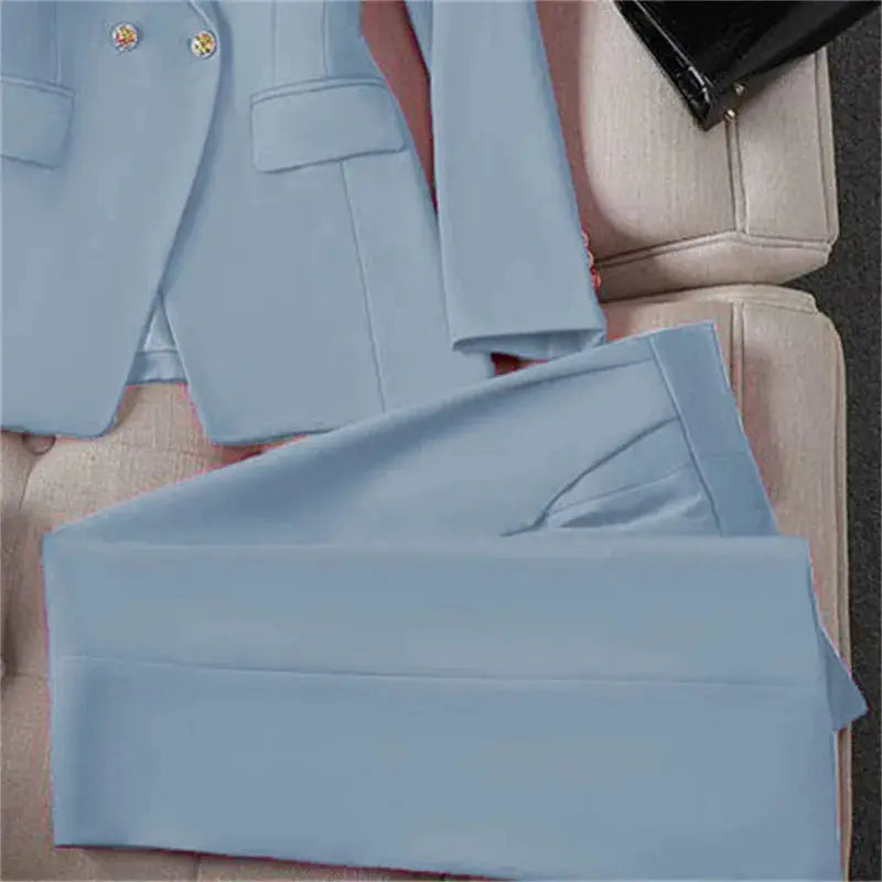 Light blue women's two-piece blazer and pants suit with long sleeves for office wear.