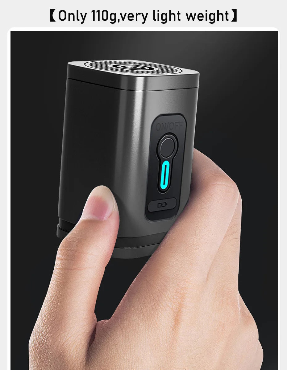 Handheld vacuum compression device with on/off switch and blue indicator light held between fingers