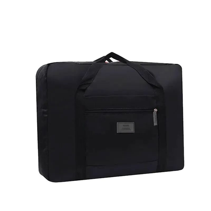 Simples Market foldable travel duffel bag, black nylon with front zipper pocket.