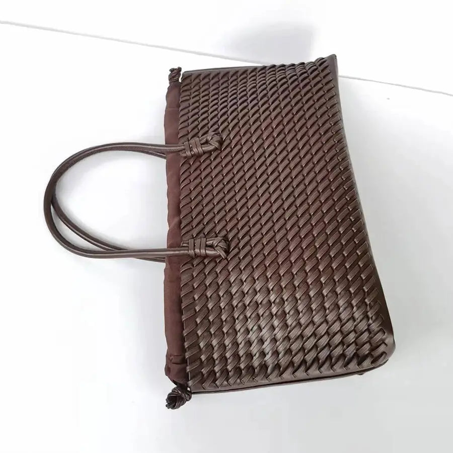 Brown woven tote bag by Simples Market with dual handles; large-capacity commuting shoulder bag