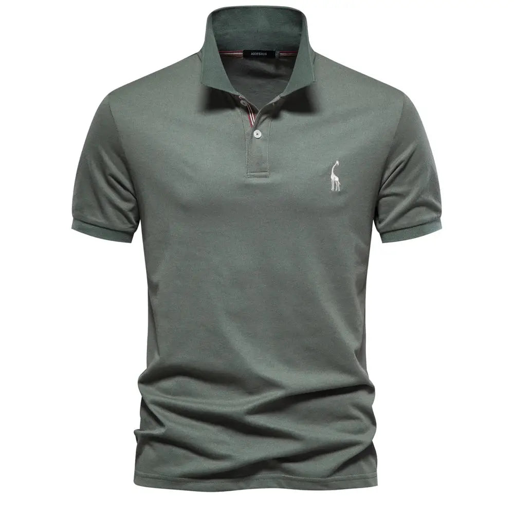 Men's sage green cotton polo shirt with short sleeves and white chest logo.