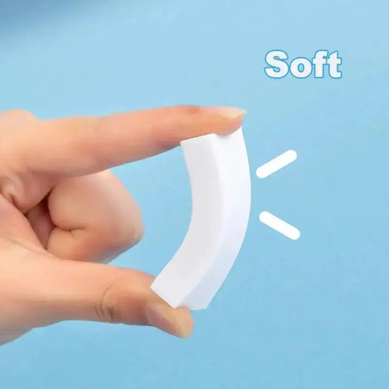 White curved eraser, soft and compact, held between fingers for school use
