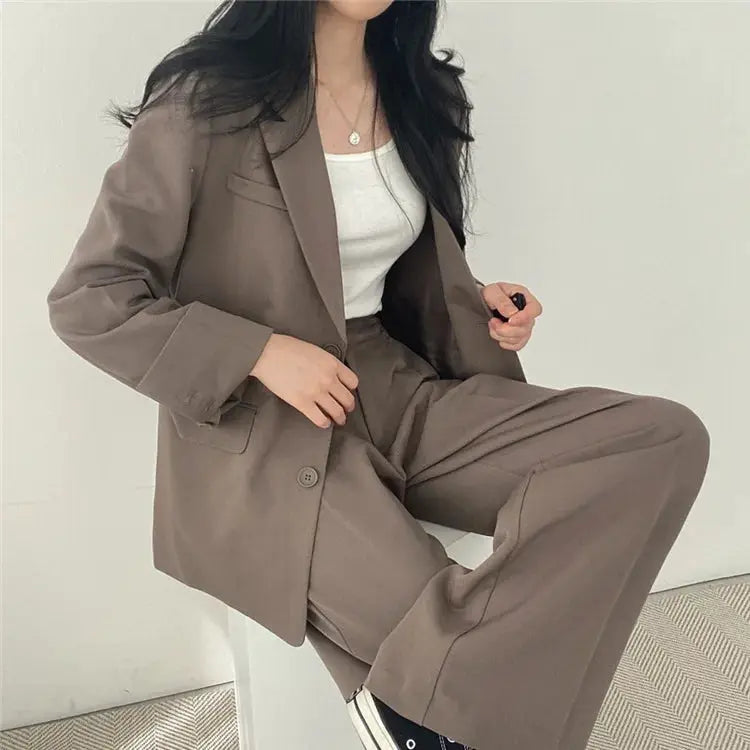 Two-piece blazer and pants set for women in taupe with a white top.