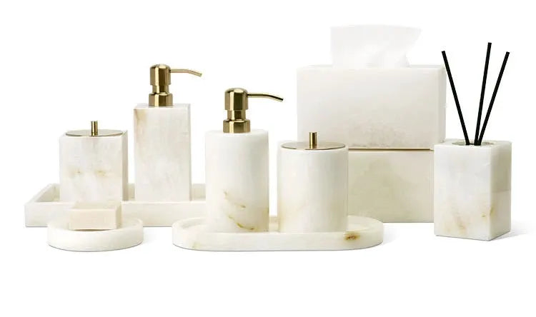White onyx marble bathroom accessories set by Simples Market with dispensers, tissue box and diffuser on a tray