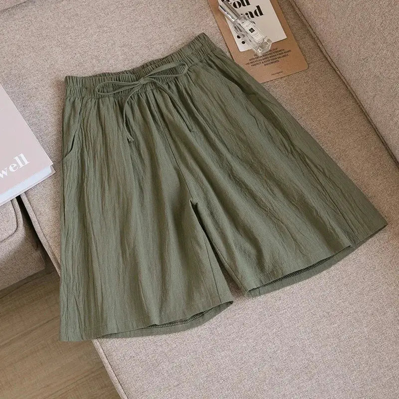 Women olive green cotton shorts by Simples Market, high-waist loose fit with drawstring and two pockets