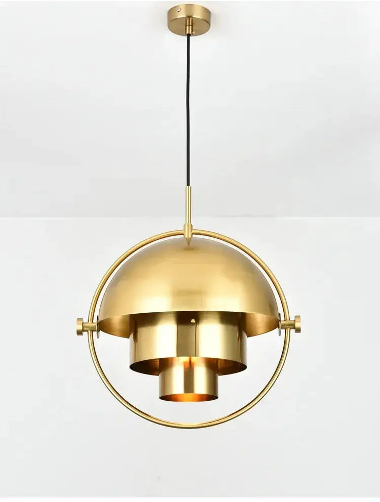 Pendant light in brass gold finish with circular ring and nested cylindrical shade for kitchen island decor