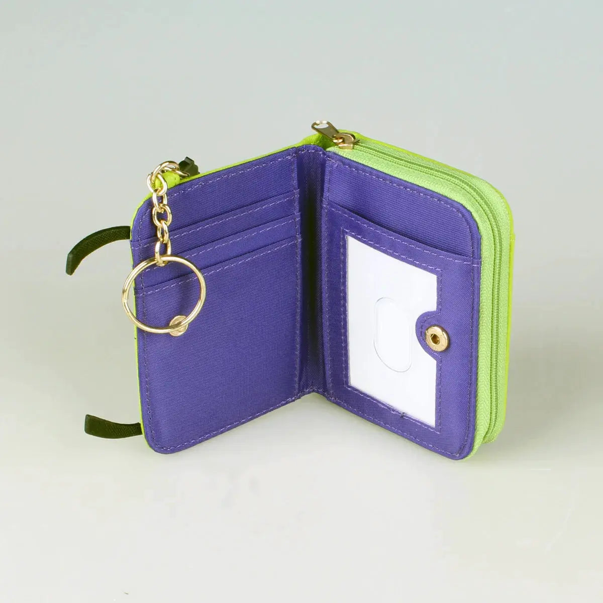 Simples Market tri-fold wallet with lime-green exterior, purple interior, ID window and key ring