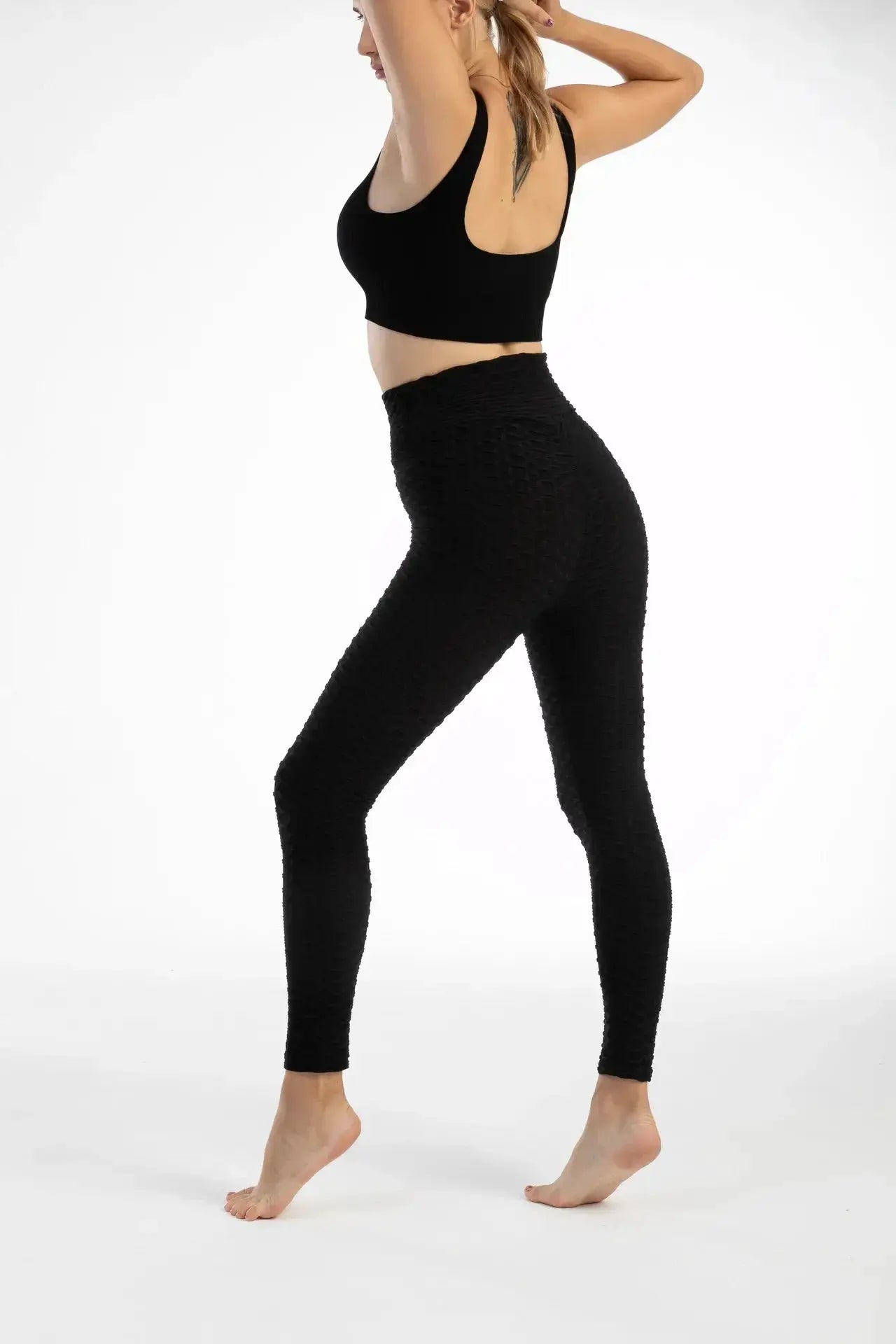 Women's high-waist bubble-textured leggings, seamless black yoga pants for gym, training and running