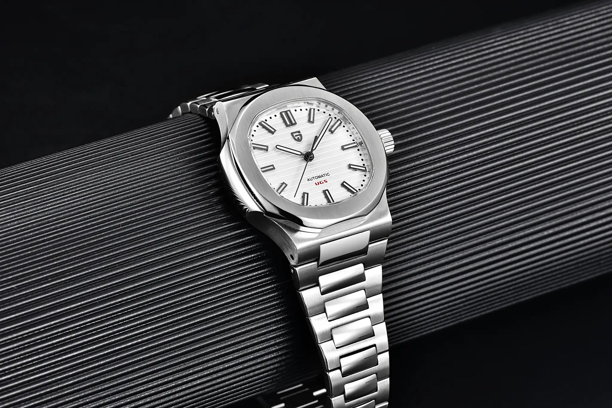 Pagani Design 40mm men's stainless steel automatic watch with sapphire glass on a ribbed black surface