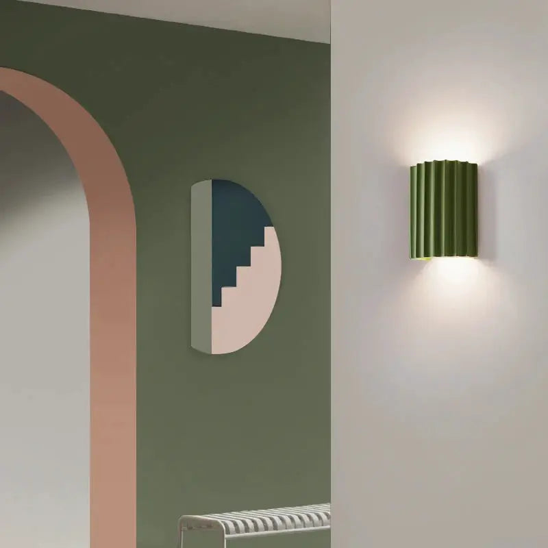 One green ribbed Nordic modern resin wall lamp for bedroom or living room.