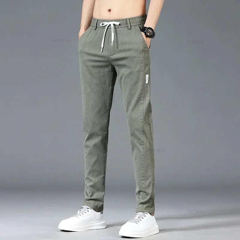 Men's casual slim straight pants with elastic drawstring waist in olive green, side pocket.