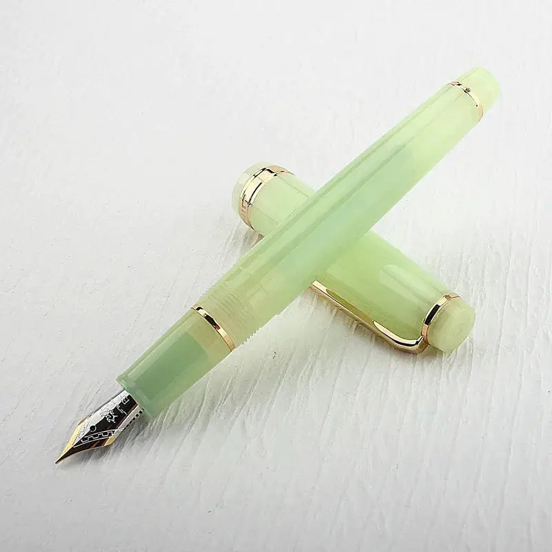 Jinhao 82 fountain pen in green acrylic with gold trim and converter