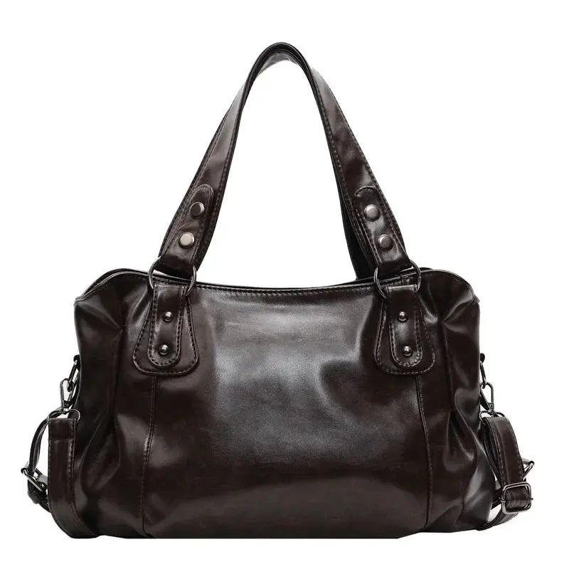 Roomy shoulder bag by Simples Market in black soft PU leather with dual top handles and detachable crossbody strap