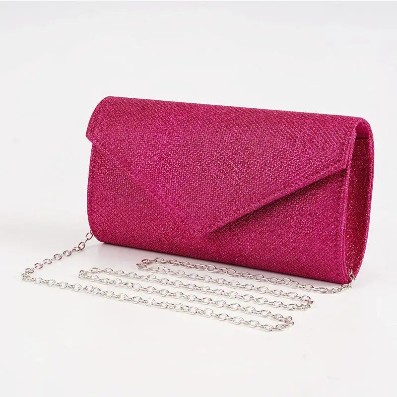Envelope evening bag with glitter pink exterior and silver chain strap, perfect for weddings and parties