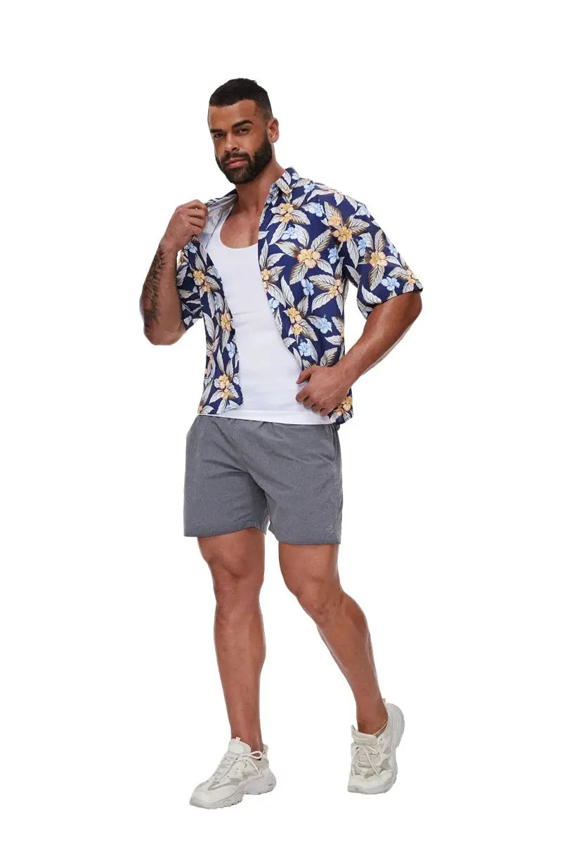 Compression shirt men by Simples Market; model wears a blue floral short-sleeve shirt over a white tee and gray shorts.