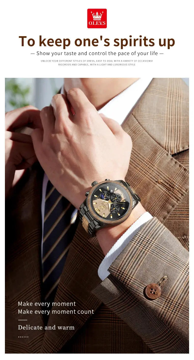 OLEVS men's wristwatch on a man wearing a brown plaid suit; black dial with gold-tone markers and subdials, metal bracelet.